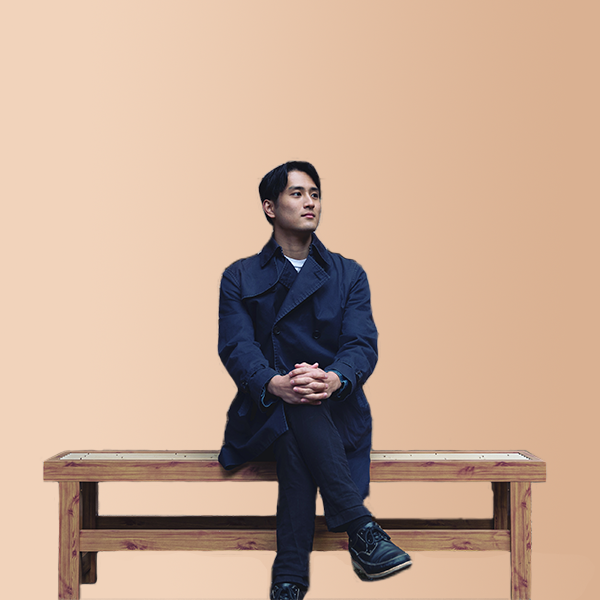 Seishiro Irie sitting on a chair
